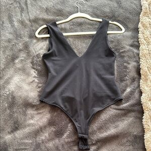 Free People Black Bodysuit with Deep V-Neck and Wide Straps